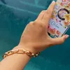 Gold-Colored Phone Wristlet